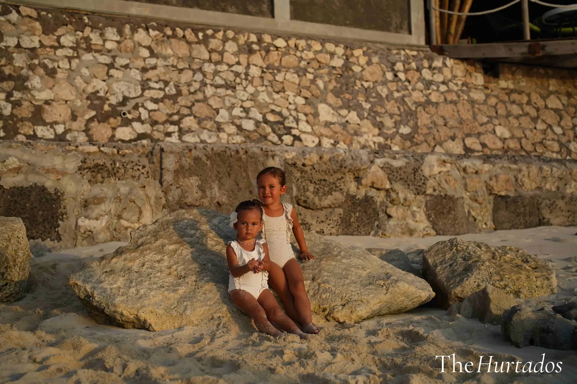 Rosalia and Risa on the rocks in Bali — exploring with kids